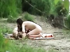 Spying on a hot young couple fucking each other in the woods