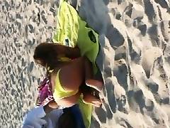 FANTASTIC GREEK YOUNG. YELLOW BIKINI AT THE BEACH TEASING US